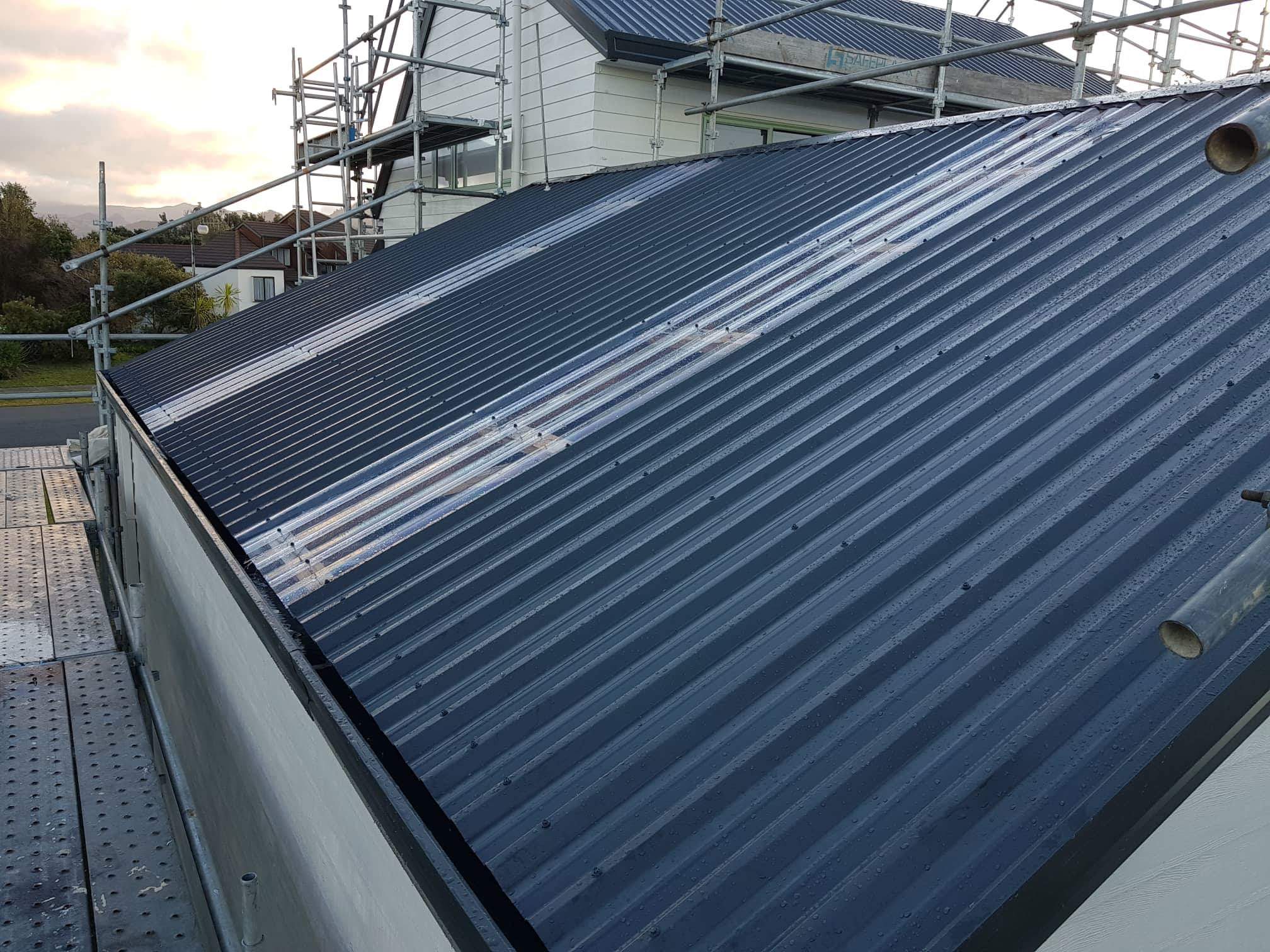 Roof repair and maintenance work on metal roofing