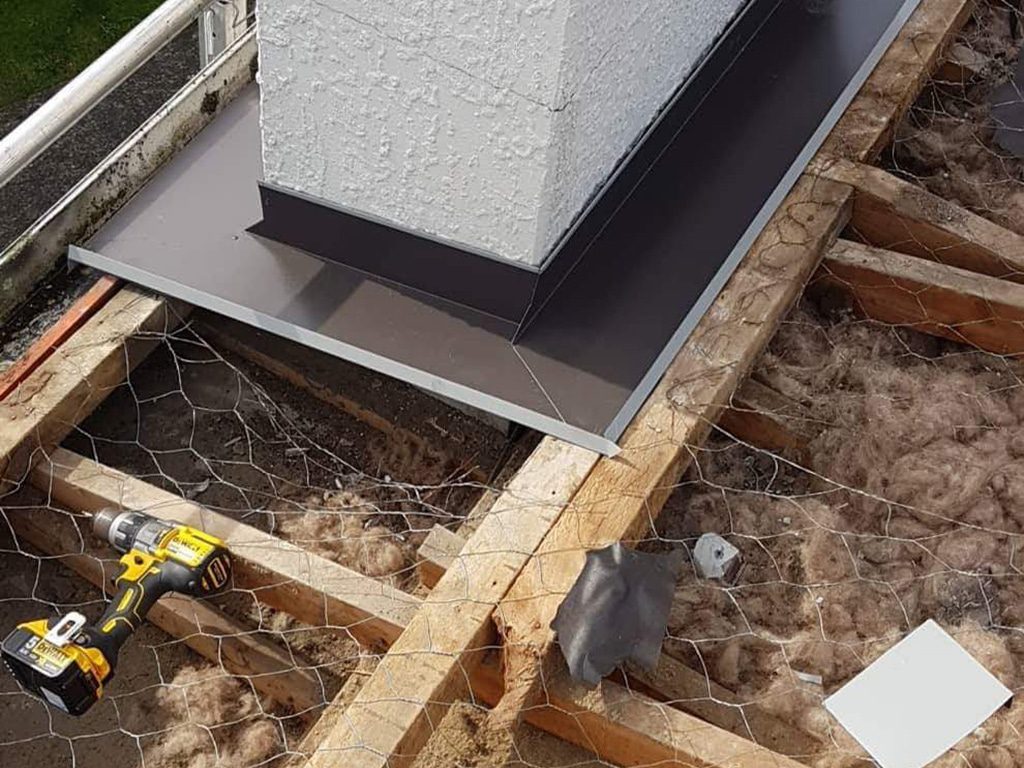 Roof leak repair work on a metal roof